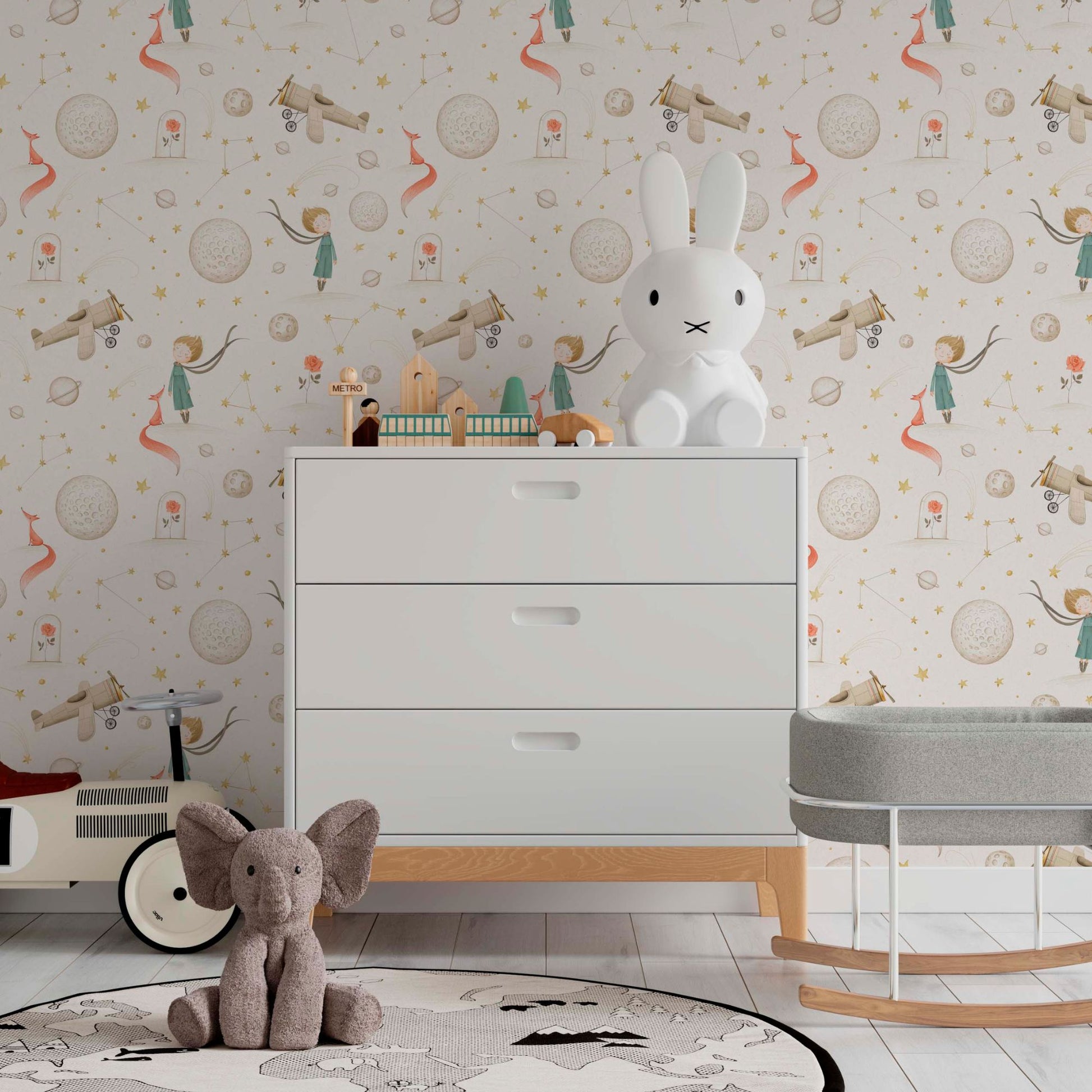 Nursery wallpaper featuring soft watercolor illustrations of the Little Prince, floating planets, stars, and vintage airplanes in a cozy children’s room
