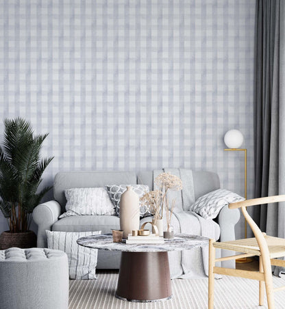 A cozy living room featuring grey and white checkered wallpaper, creating a stylish and inviting atmosphere.