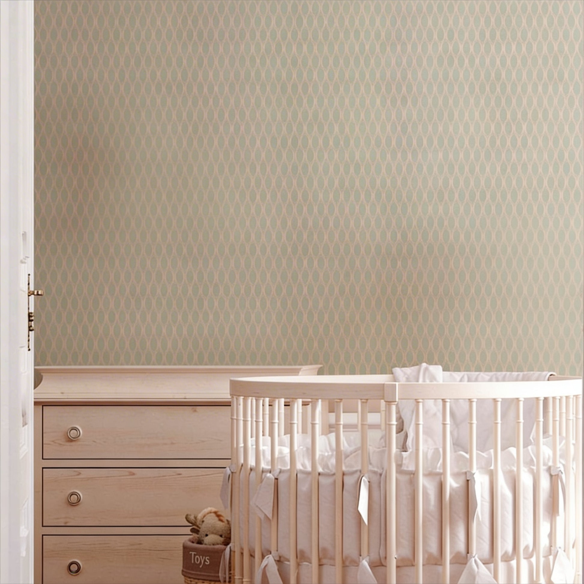 cat-615198294344 Mint green geometric wallpaper on a nursery wall behind a wooden crib and dresser.