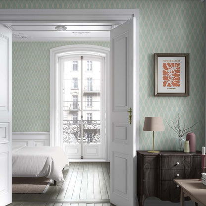 cat-616983200072 Mint green and white geometric wallpaper on a bedroom wall with a dark wood dresser and white doors.