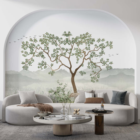 cat-610569683272  A stylish living room featuring a scenic nature wallpaper mural with a large tree inside a large wall arch behind a curved sofa.