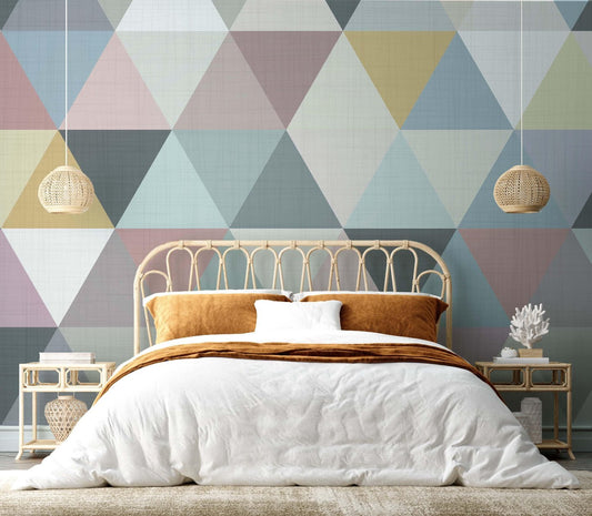 A stylish bedroom with eye-catching geometric wallpaper and a neatly made bed, offering a cozy and modern living space.