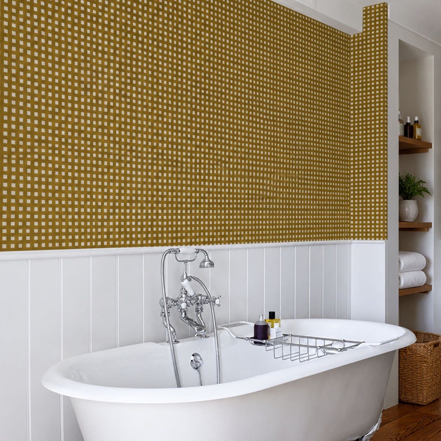 Mustard wallpaper with a hand-drawn checkered pattern in a traditional bathroom with white wall panelling.
