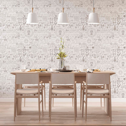 cat-659356549448  Modern dining room with a light wood table and chairs featuring vintage alchemy manuscript wallpaper with botanical sketches, sun symbols, and esoteric Latin text under three white pendant light
