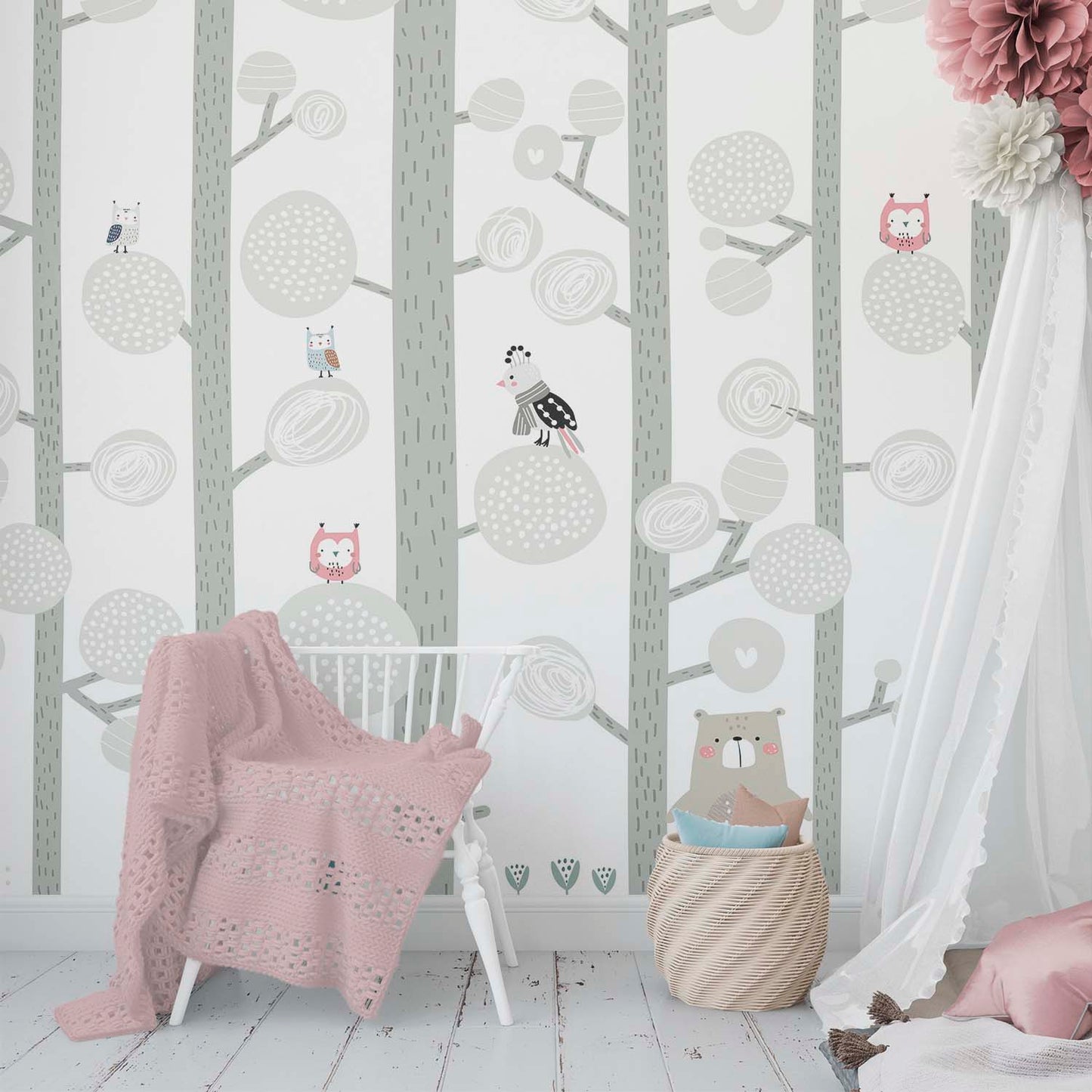 sweet nursery bedroom with a pastel color woodland wallpaper mural