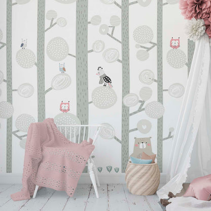 sweet nursery bedroom with a pastel color woodland wallpaper mural