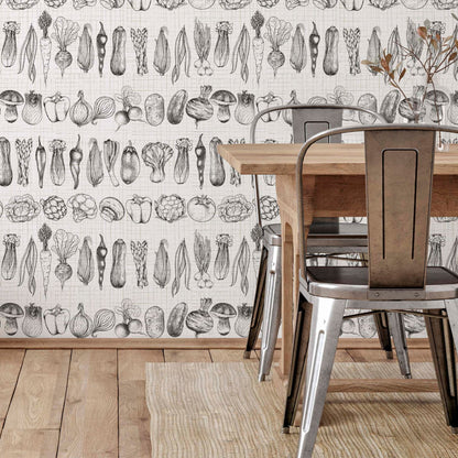 cat-659356549448  Rustic dining room featuring a wooden table and galvanized metal chairs against a wall with black and white vegetable sketch wallpaper. The floor is light wood with a jute rug.