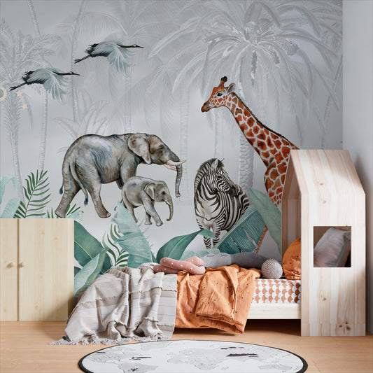Kids' bedroom featuring a large wallpaper mural with a safari theme, showing a giraffe, elephants, and a zebra among tropical jungle leaves.