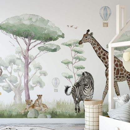Safari Animals wallpaper mural in a nursery with house-shaped bed, zebra, giraffe and lion cubs in soft sage green watercolor tones