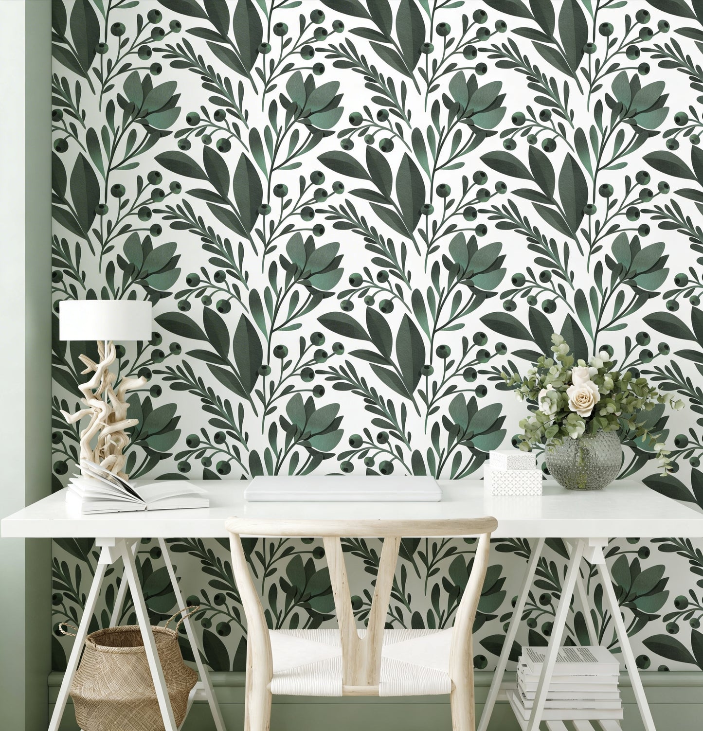 cat-610804433224 Modern home office with sage green botanical leaf wallpaper, a white minimalist desk, and a wooden chair with a white cushion