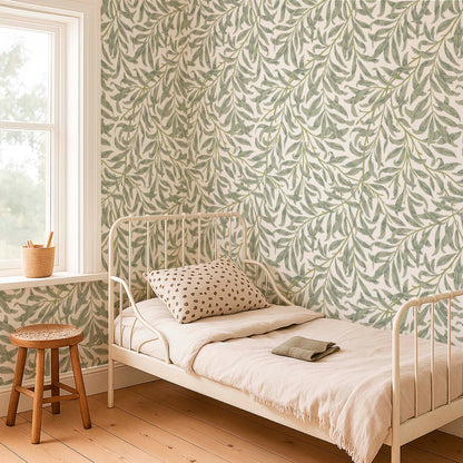 Minimalist bedroom with sage green willow wallpaper, a white metal bed frame, and light wood floors.