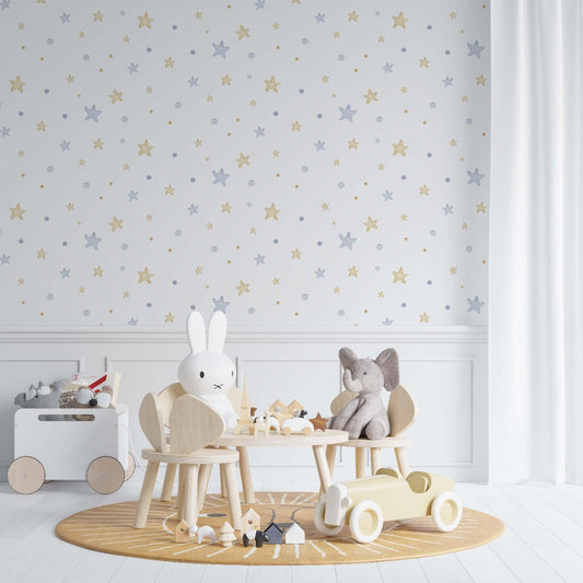 A cozy children's playroom featuring light wooden furniture, including animal-shaped chairs with a bunny and elephant toy. The room has star-patterned wallpaper in soft gold and blue tones, a sun-themed round rug, and wooden toys scattered on the floor, creating a peaceful and playful environment.