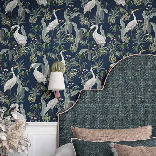 A beautifully designed  elegant wallpaper  that features a vibrant design of white herons surrounded by lush tropical leaves decorates the bedroom wall, adding charm and sophistication.