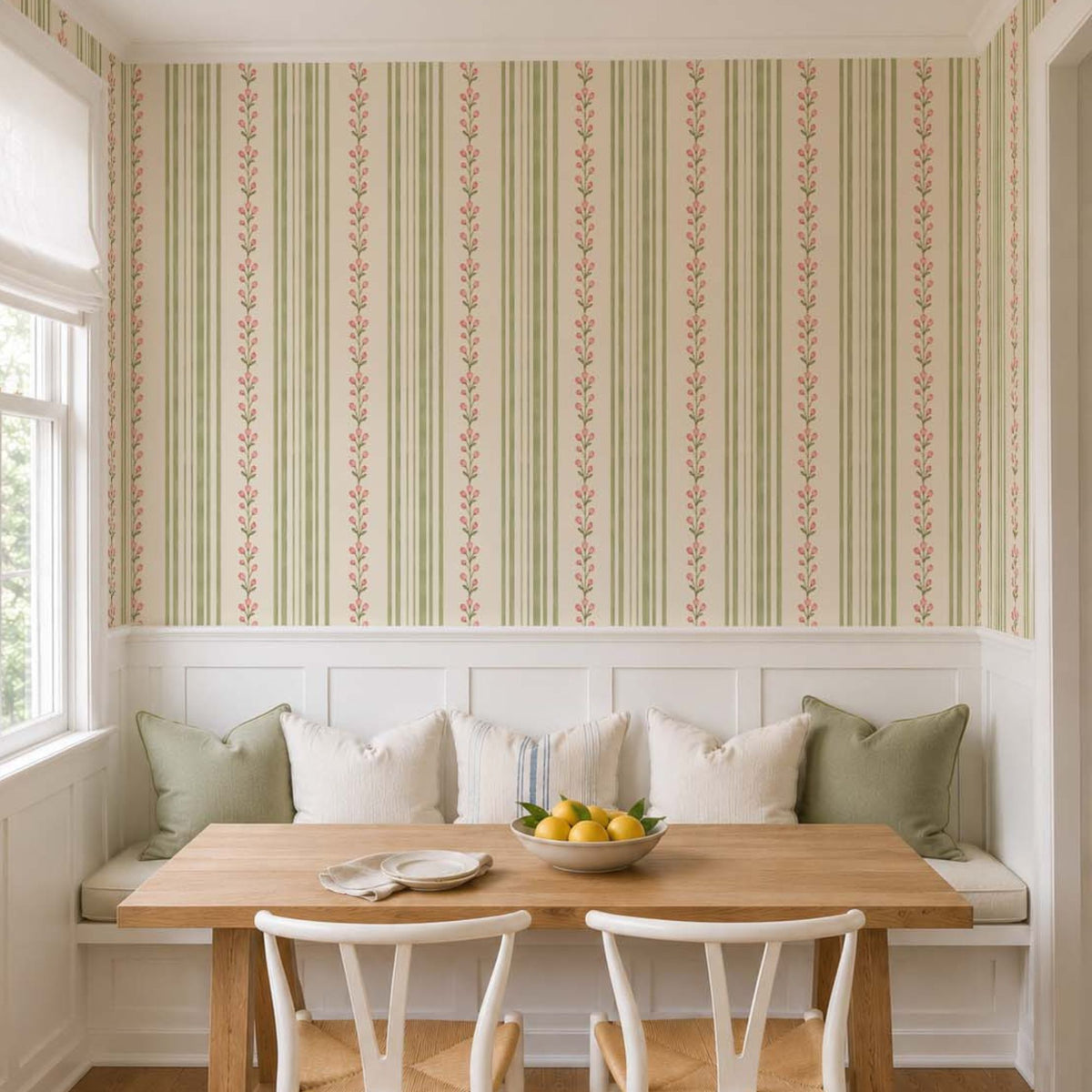 cat-659356549448   Breakfast nook with sage green and pink Tulip Stripe wallpaper above white wainscoting