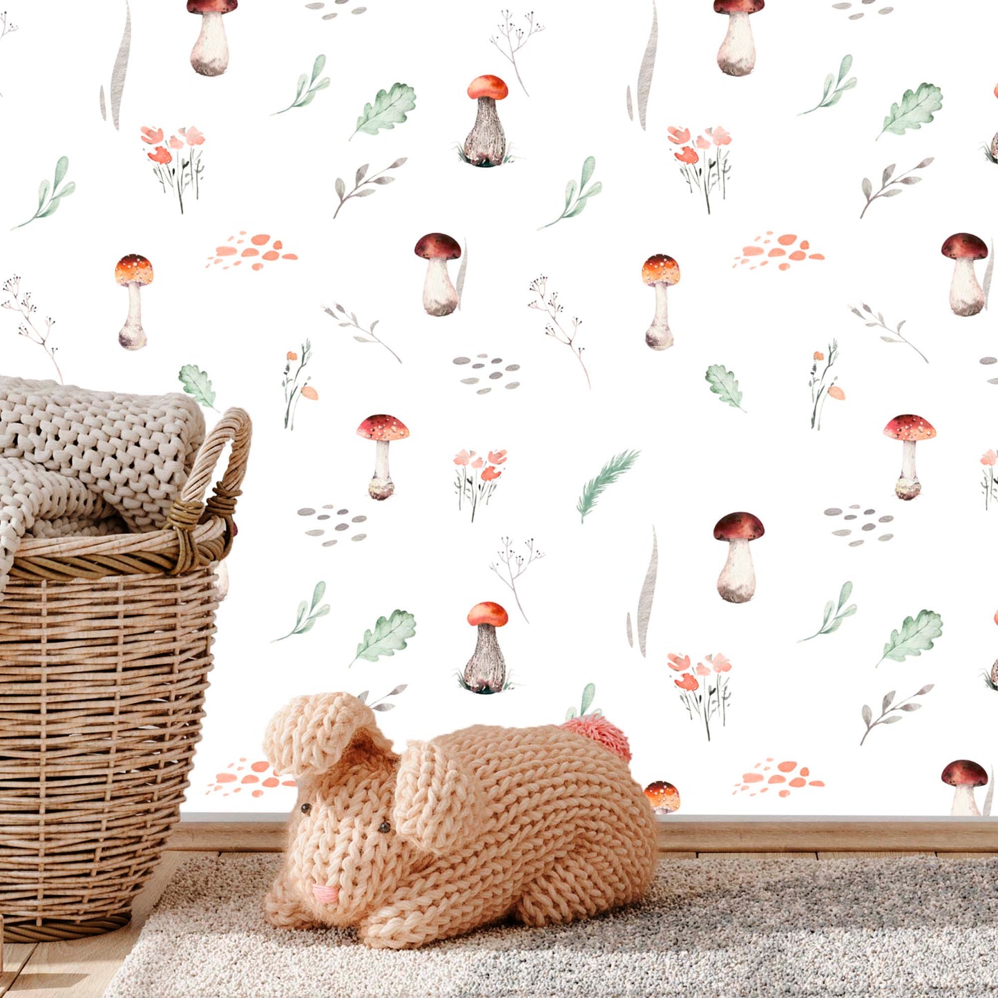 cat-615198294344 Nursery room featuring watercolor mushroom wallpaper, a wicker basket with a gray blanket, and a white shelving unit with toys.