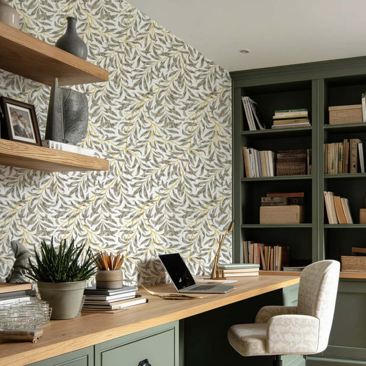 cat-610804433224 Home office with Willow Leaf wallpaper, green built-in cabinets and natural wood desk, creating a warm and timeless workspace.