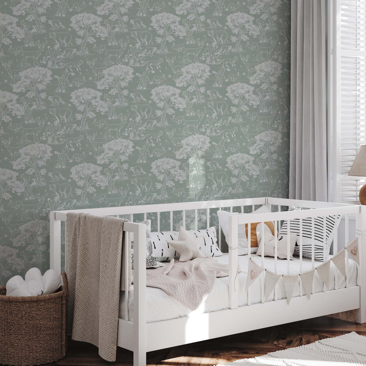 Kids bedroom featuring a white crib and a toile style wallpaper