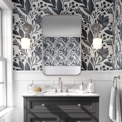 Elegant bathroom adorned with a greye and white leaves wallpaper, showcasing a chic grey vanity.