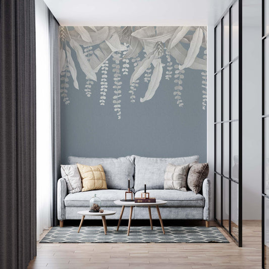small living room with banana leaves mural in grey and teal blue