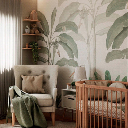 Storks in the jungle - tropical wallpaper mural featuring soft green banana trees and mother and baby stork in a nursery bedroom